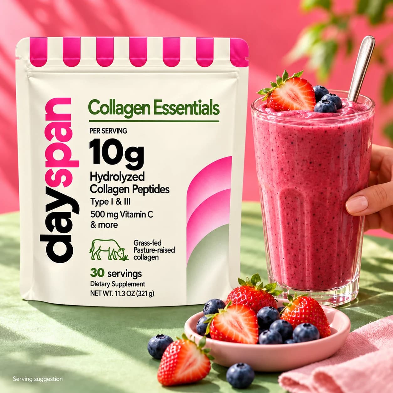Collagen Essentials bag beside a berry smoothie and fresh fruit; serving suggestion