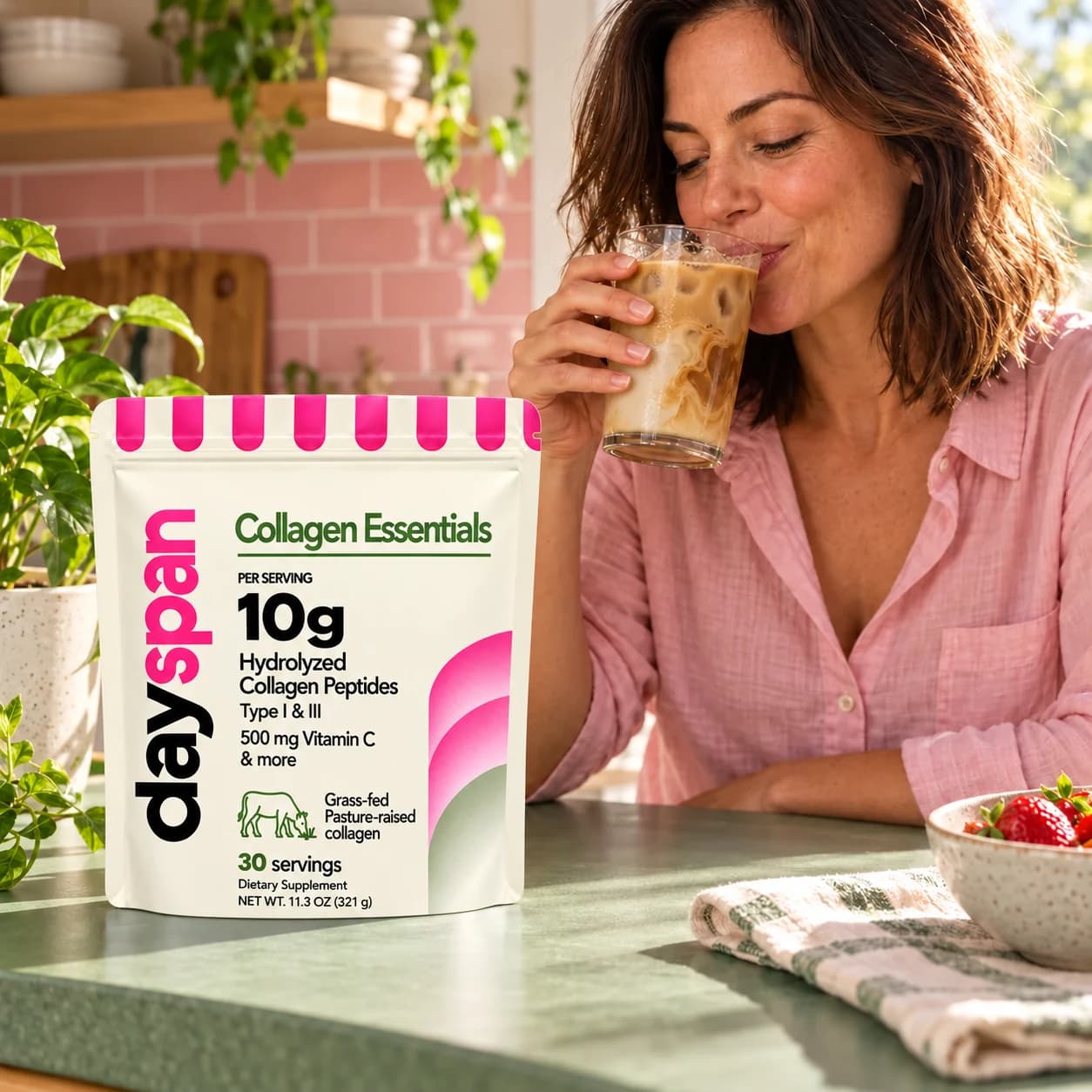 Woman enjoying iced coffee beside the Collagen Essentials bag; serving suggestion