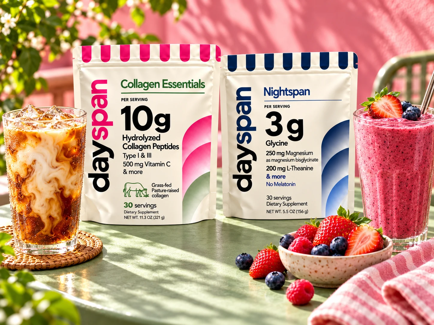 Dayspan Collagen Essentials and Nightspan bags together on a sunlit café table with iced coffee and a berry smoothie; serving suggestions